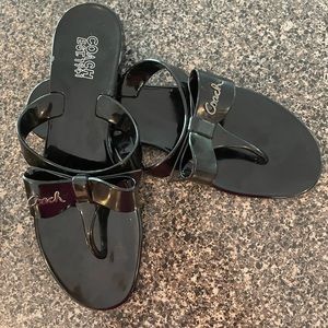 Coach flip flops, black patent color with a cute bow. Like new,size8,worn once